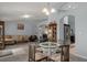 Open concept dining area with elegant table and seating, connecting to a spacious living area at 10149 Rockbay Rd, Brooksville, FL 34601
