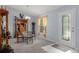 Bright dining area featuring a glass table, decorative chairs, and natural light at 10149 Rockbay Rd, Brooksville, FL 34601