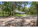 Charming one-story home with a well-maintained lawn and a driveway leading to an attached garage at 10149 Rockbay Rd, Brooksville, FL 34601