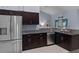 This spacious kitchen features stainless steel appliances and granite countertops at 10149 Rockbay Rd, Brooksville, FL 34601