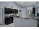Well-appointed kitchen with dark cabinets, granite counters, and stainless steel appliances at 10149 Rockbay Rd, Brooksville, FL 34601