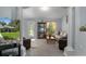 Bright living room with elegant pillars, comfortable seating, and decorative accents at 10149 Rockbay Rd, Brooksville, FL 34601