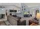 Open-concept living room with kitchen view, nautical decor, and comfortable furnishings at 10149 Rockbay Rd, Brooksville, FL 34601