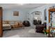 Inviting living room showcasing neutral tones, plush seating, and elegant decor at 10149 Rockbay Rd, Brooksville, FL 34601