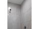 Elegant walk-in shower with seamless glass and designer tile accents at 10149 Rockbay Rd, Brooksville, FL 34601