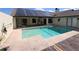 Backyard with a solar-paneled house and refreshing pool for eco-friendly living and recreation at 10244 Hoover St, Spring Hill, FL 34608