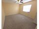 Clean bedroom design featuring a ceiling fan and carpet at 10244 Hoover St, Spring Hill, FL 34608