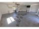 Open bonus room with tiled flooring and ceiling fans at 10244 Hoover St, Spring Hill, FL 34608