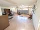 Spacious garage with a ceiling fan and a standard garage door at 10244 Hoover St, Spring Hill, FL 34608