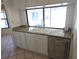 A well-lit kitchen with a view of the backyard pool at 10244 Hoover St, Spring Hill, FL 34608