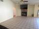The living room features an attractive fireplace and tile flooring at 10244 Hoover St, Spring Hill, FL 34608