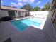 Inviting backyard pool with a spacious concrete deck for lounging and entertaining at 10244 Hoover St, Spring Hill, FL 34608