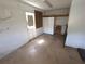Small storage room with a single door and overhead lighting at 10244 Hoover St, Spring Hill, FL 34608