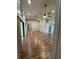 Bright living room with laminate flooring, neutral paint, vaulted ceilings, and a ceiling fan at 10301 Ravines Dr, New Port Richey, FL 34654