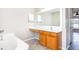 Bathroom featuring a vanity, tub and tile flooring at 10386 Norvell Rd, Spring Hill, FL 34608