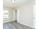 Cozy bedroom featuring a closet, and grey flooring at 10386 Norvell Rd, Spring Hill, FL 34608