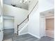 View of the home's entry, staircase, and wood-look flooring at 10386 Norvell Rd, Spring Hill, FL 34608