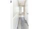 Hallway with grey flooring and paneled walls at 10386 Norvell Rd, Spring Hill, FL 34608