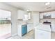 Renovated kitchen with white cabinets, stainless steel appliances, and a bright, airy atmosphere at 10386 Norvell Rd, Spring Hill, FL 34608