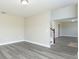 Spacious living room with modern floors, perfect for relaxing or entertaining guests at 10386 Norvell Rd, Spring Hill, FL 34608