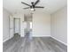 Open living room with grey flooring and neutral walls at 10386 Norvell Rd, Spring Hill, FL 34608