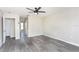 Open living room with grey flooring and neutral walls at 10386 Norvell Rd, Spring Hill, FL 34608