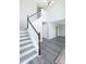 Staircase leading to the second floor, with modern flooring, and natural light at 10386 Norvell Rd, Spring Hill, FL 34608