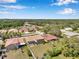 An aerial view of residences with mature trees and landscaping in the surrounding area at 11726 Belle Haven Dr, New Port Richey, FL 34654