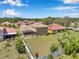 Aerial view showing fenced in yard, mature trees and landscaping at 11726 Belle Haven Dr, New Port Richey, FL 34654