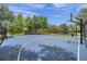 Community basketball court with trees, offering recreational opportunities for residents at 11726 Belle Haven Dr, New Port Richey, FL 34654