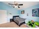 Blue ' bedroom featuring ceiling fan, light, and decor at 11726 Belle Haven Dr, New Port Richey, FL 34654