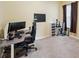 Bedroom with neutral walls and carpet, featuring a functional workspace with a desk setup at 11726 Belle Haven Dr, New Port Richey, FL 34654