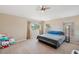 Bedroom features carpet and neutral colors, with ample natural light at 11726 Belle Haven Dr, New Port Richey, FL 34654
