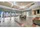 Spacious clubhouse with tables, chairs, and bar area, perfect for social gatherings and events at 11726 Belle Haven Dr, New Port Richey, FL 34654