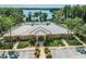 Exterior aerial view of neighborhood clubhouse amenities and parking at 11726 Belle Haven Dr, New Port Richey, FL 34654