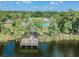 Waterfront views of the neighborhood pier overlooking the lake and community pool at 11726 Belle Haven Dr, New Port Richey, FL 34654