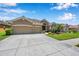 Charming home with a two-car garage, beautiful landscaping, and inviting entrance at 11726 Belle Haven Dr, New Port Richey, FL 34654