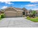 Charming home with a two-car garage, beautiful landscaping, and inviting entrance at 11726 Belle Haven Dr, New Port Richey, FL 34654