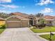 Well maintained home with a three-car garage and mature landscaping at 11726 Belle Haven Dr, New Port Richey, FL 34654