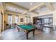 Fun-filled game room with pool table, ping pong, and foosball, offering entertainment for all ages at 11726 Belle Haven Dr, New Port Richey, FL 34654