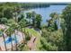 Scenic community amenities include a lake view, pool, and splashpad with winding sidewalks at 11726 Belle Haven Dr, New Port Richey, FL 34654