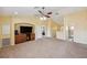 Spacious living room with neutral walls and carpet with entertainment center at 11726 Belle Haven Dr, New Port Richey, FL 34654