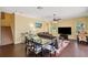 Bright living area with a cozy seating area, adjacent to a dining space at 11726 Belle Haven Dr, New Port Richey, FL 34654