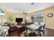 Open-concept living room boasts large windows and a seamless connection to the outdoor patio at 11726 Belle Haven Dr, New Port Richey, FL 34654