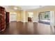 Bright and spacious living room featuring beautiful tile floors, access to other rooms and patio at 11726 Belle Haven Dr, New Port Richey, FL 34654