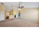 Spacious loft area with carpet, neutral walls, and a view of the downstairs at 11726 Belle Haven Dr, New Port Richey, FL 34654