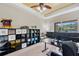 Bright office with shelving and multiple computer setups for working at home at 11726 Belle Haven Dr, New Port Richey, FL 34654