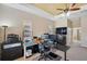 Comfortable office setup with desk, cabinets, and view into the en suite bathroom at 11726 Belle Haven Dr, New Port Richey, FL 34654