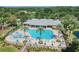 Aerial shot showcases the community pool, sun loungers, and well-manicured landscaping at 11726 Belle Haven Dr, New Port Richey, FL 34654
