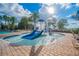 Community splashpad with waterslides and a jungle gym at 11726 Belle Haven Dr, New Port Richey, FL 34654